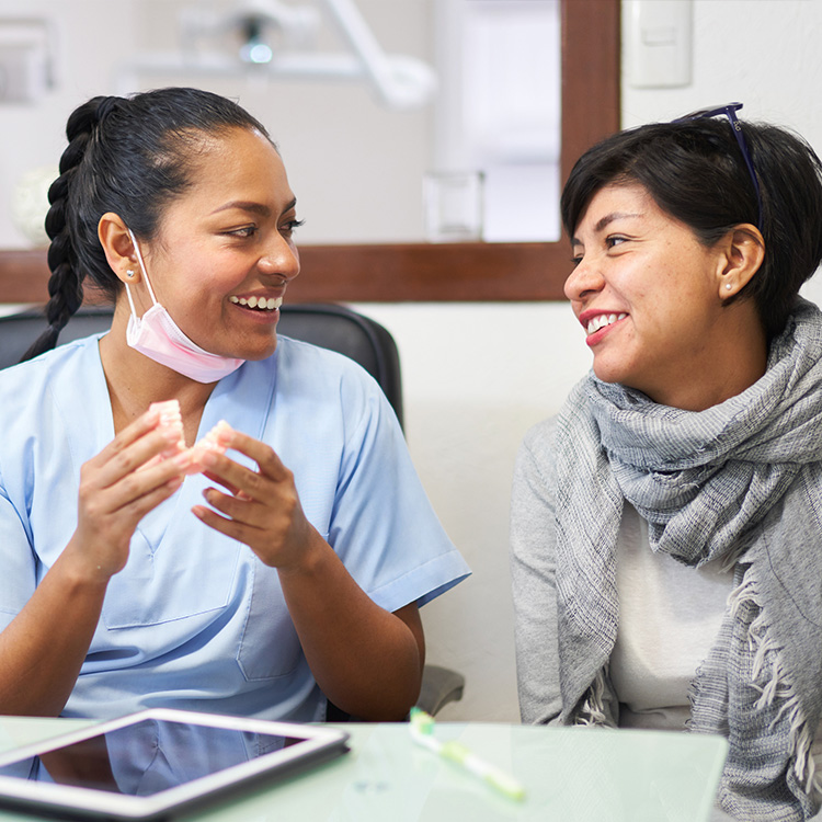 Dentist and patient having a conversation
