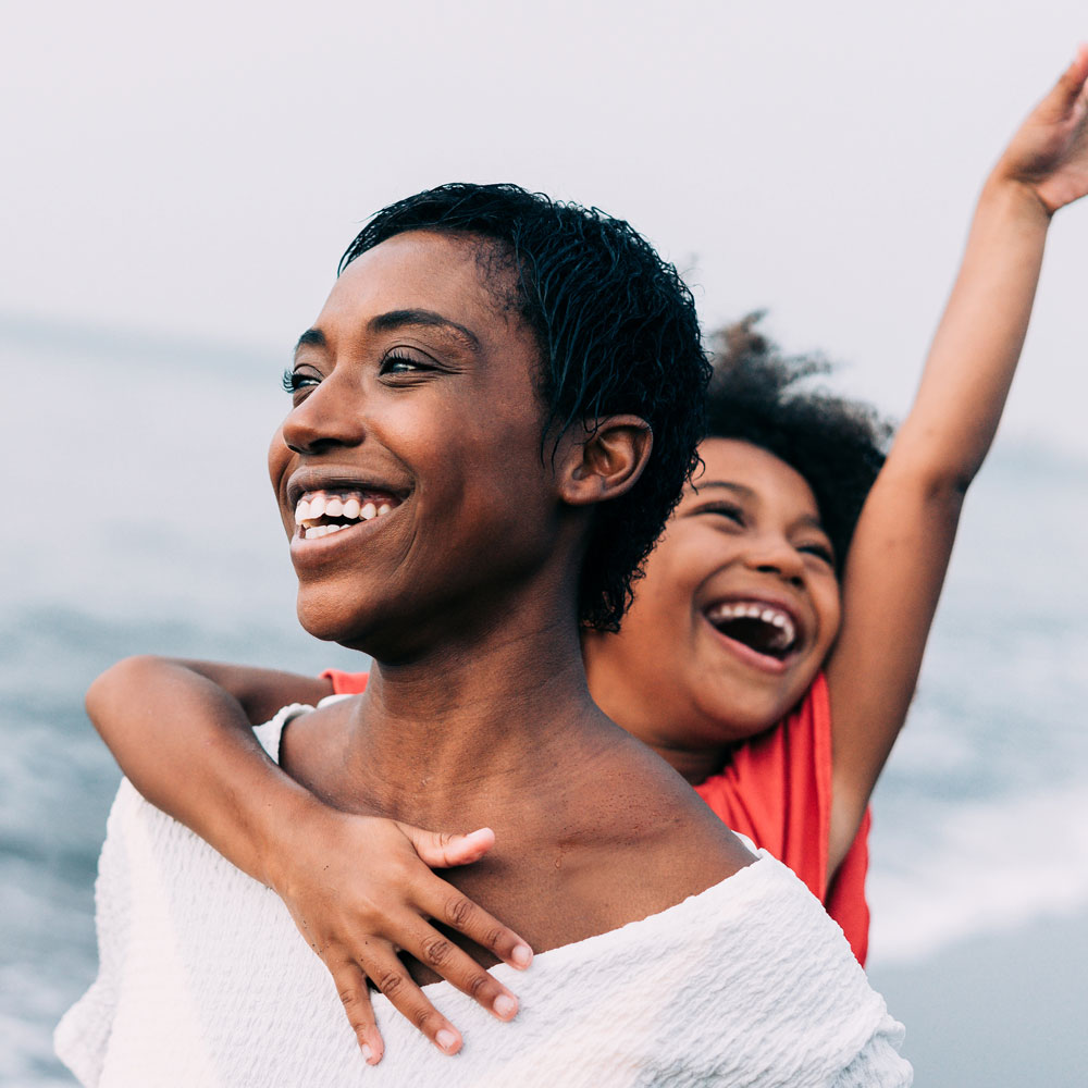 An image of a mother and child smiling